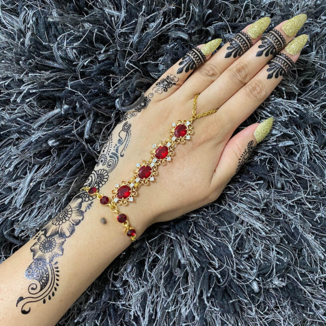 Red bracelet on sale with hand